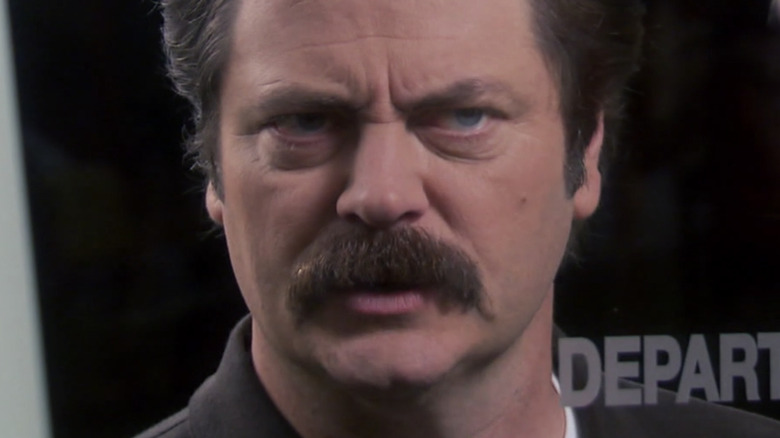 Ron Swanson threatening Gerry through a doorway