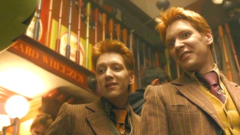 Fred and George Weasley smirking maliciously 