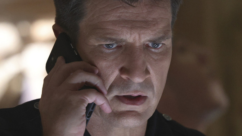 Nathan Fillion looking worried