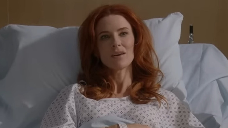 Monica Stevens laying in a hospital bed