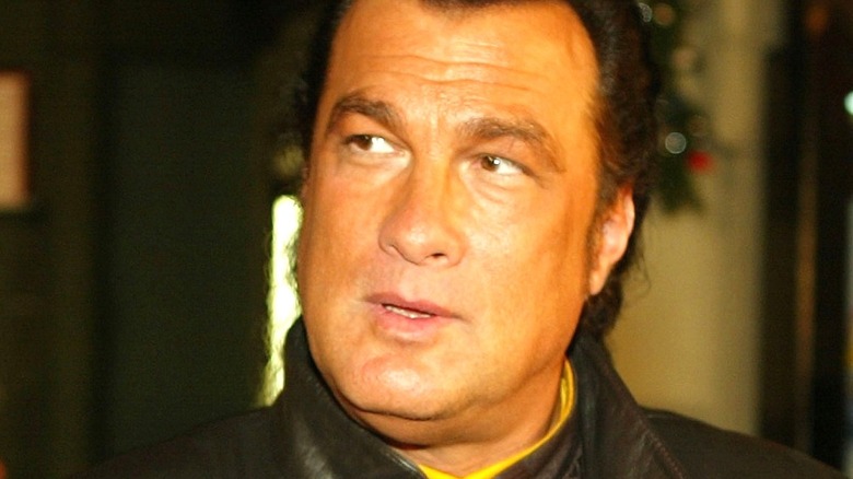 Steven Seagal looking at photographers