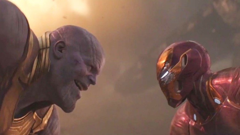 Thanos and Iron Man looking at each other
