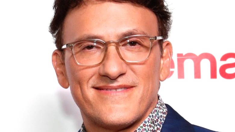 Anthony Russo smiling for photographers