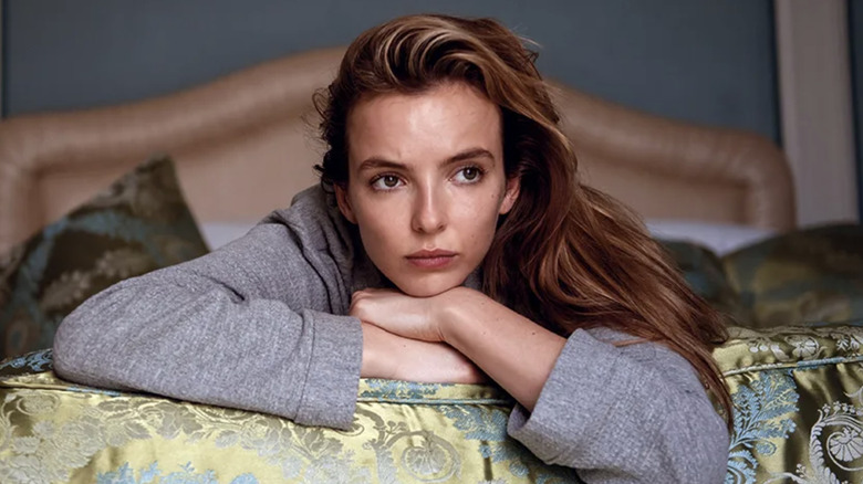 Villanelle rests on a bed thinking in Killing Eve