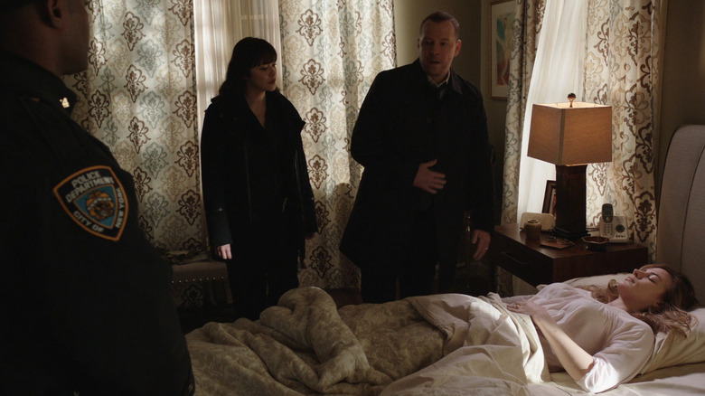 Danny and Maria stand over Emily's body
