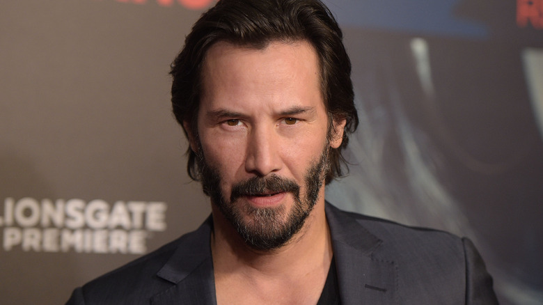 Keanu Reeves looking serious at 