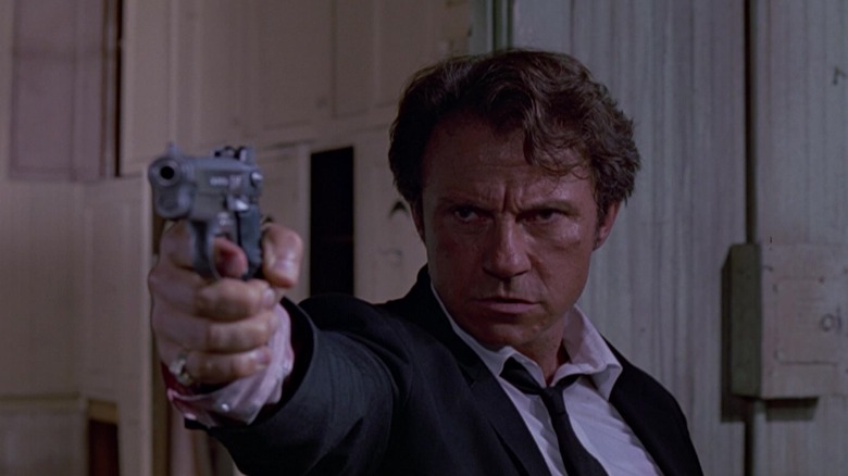 Harvey Keitel aiming guns