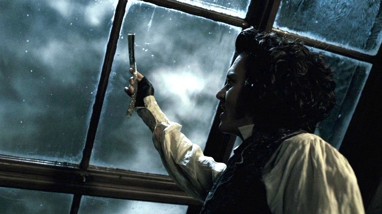 Johnny Depp holding razor