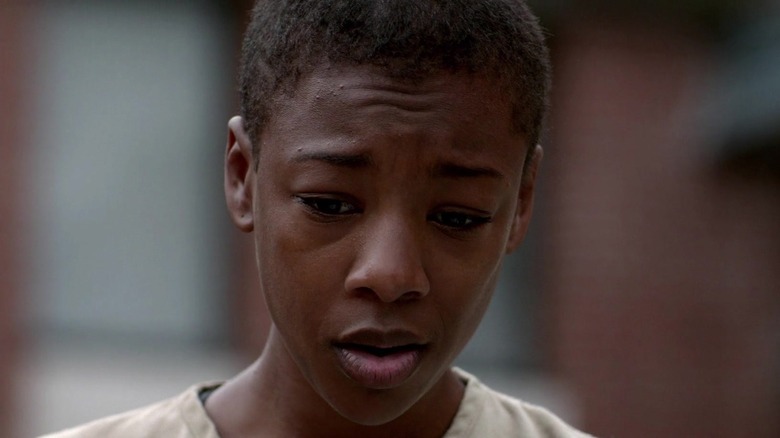 Poussey Washington looks down