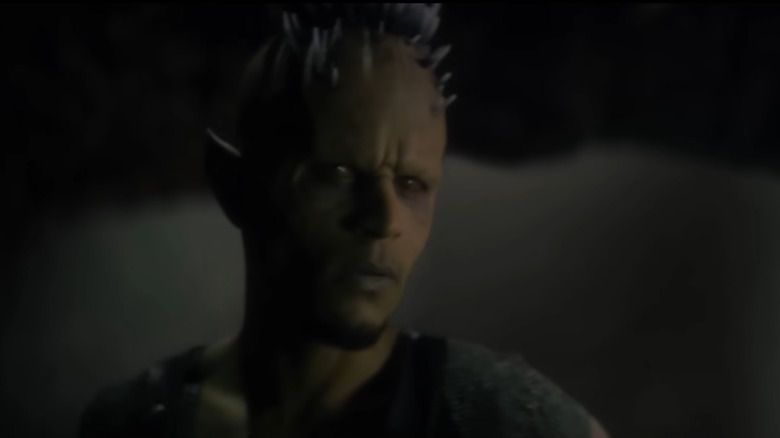 Spiky green demon looks concerned