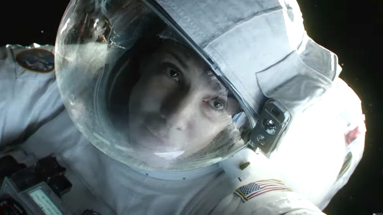 Sandra Bullock wearing astronaut suit