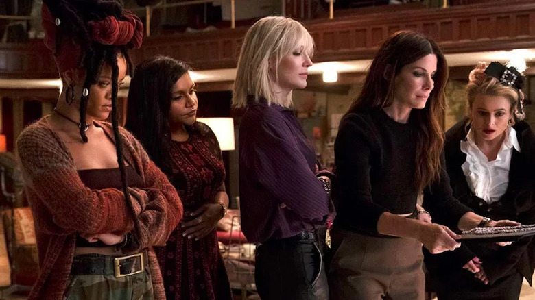 Ocean's 8 women look at document