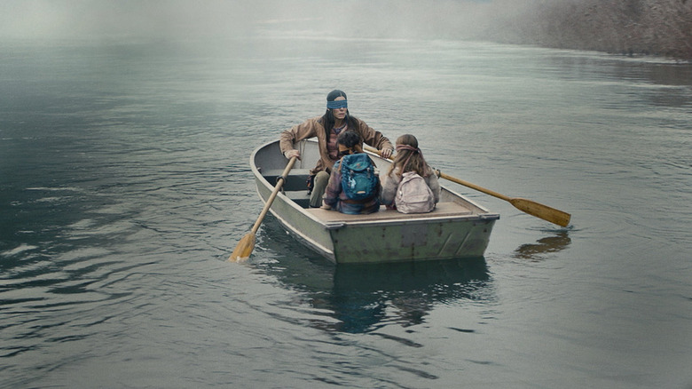 Bullock and kids in rowboat