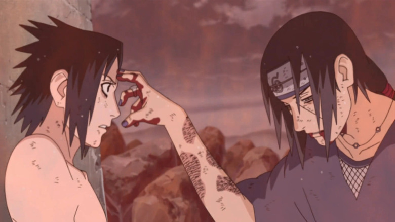 Itachi touching Sasuke's head