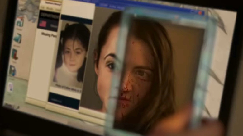 Leena looks at her own bloodied face in a mirror beside photos of a girl
