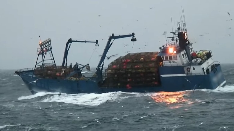 Fishing boat rolling in rough seas
