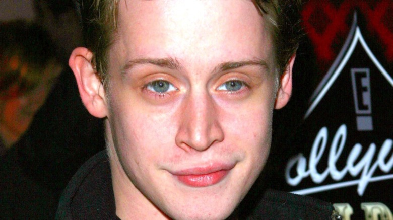 Macaulay Culkin smirking