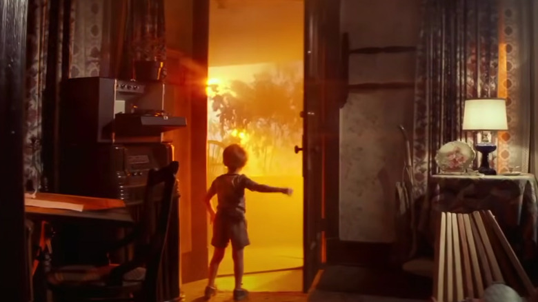 The Neary boy opens the door