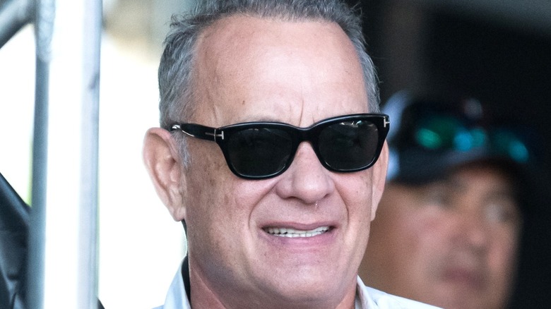 Hanks poses at event 