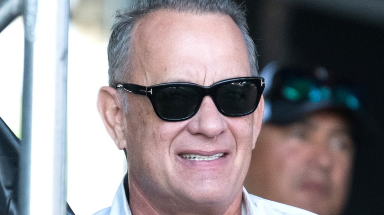 Tom Hanks poses at event