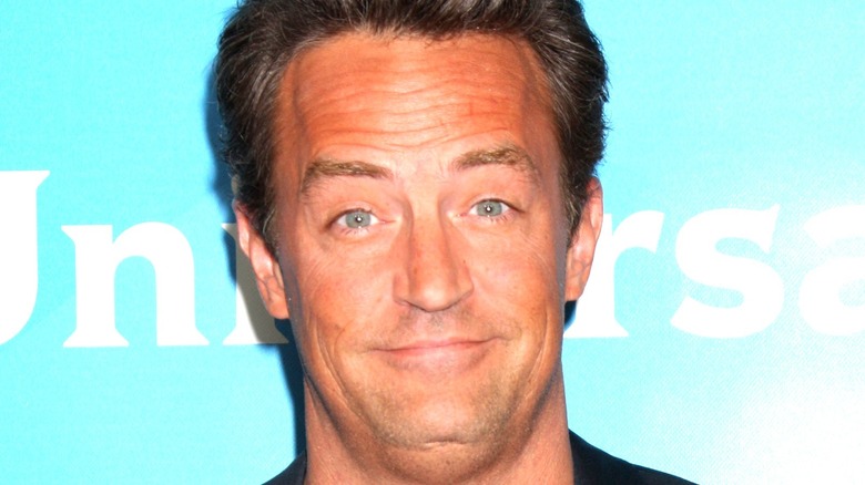 Matthew Perry smirking