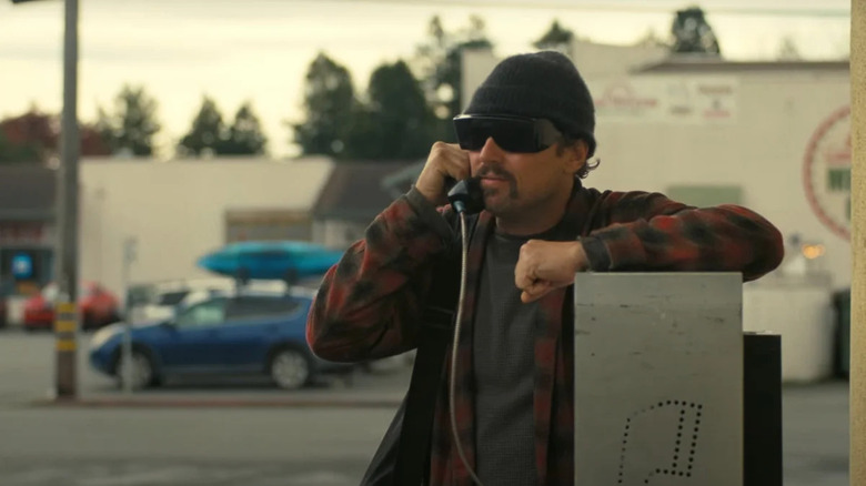 Calhoun talks on a payphone in One Battle After Another