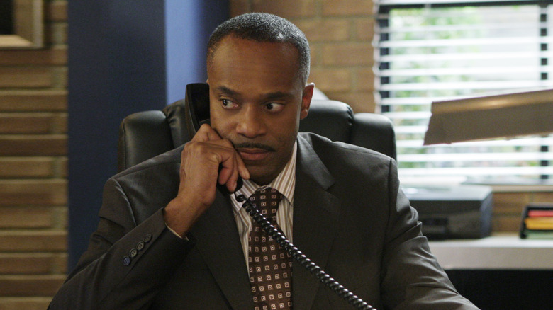 Rocky Carroll as Leon Vance making a call in his office