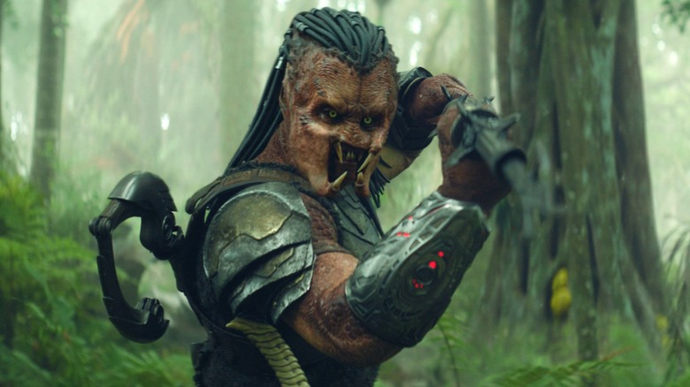 Dek wielding a weapon in Predator: Badlands