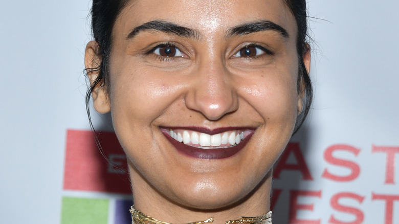 Amrit Kaur smiling at an event