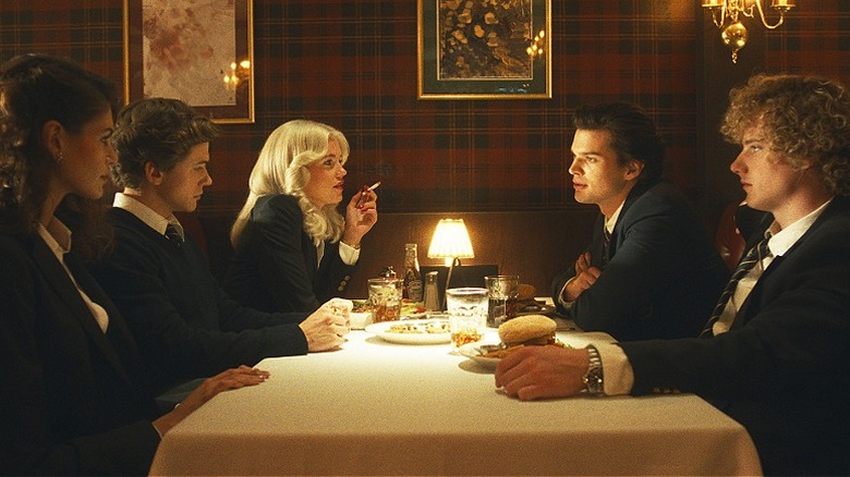 Susan, Bret, Debbie, Robert, and Thom sitting at a restaurant