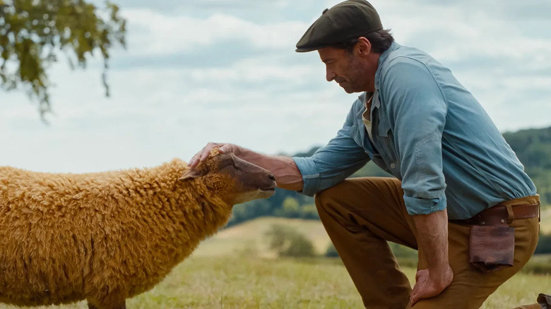George petting Lily in The Sheep Detectives