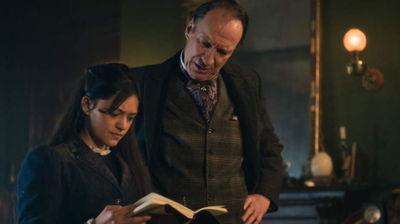 Sherlock and Amelia read a book in "Sherlock & Daughter"
