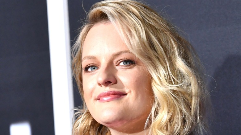 Elisabeth Moss smiles at event