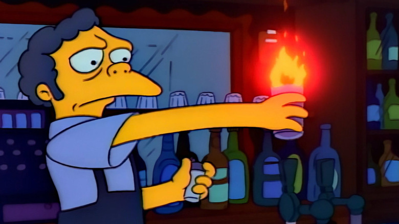 Moe holding a flaming drink on The Simpsons