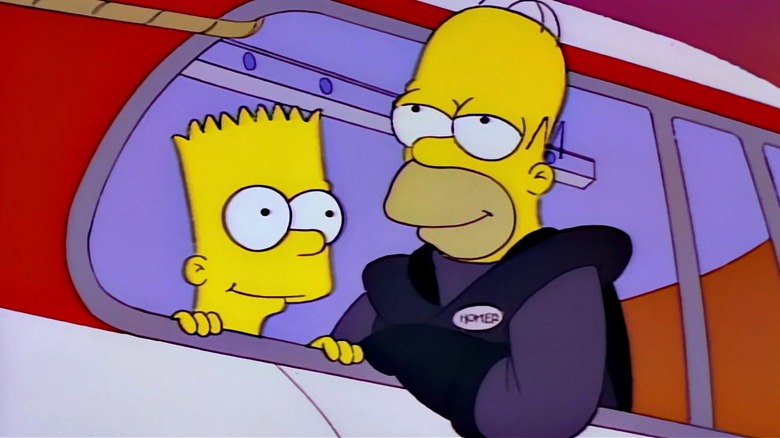 Homer and Bart leaning on a monorail on The Simpsons