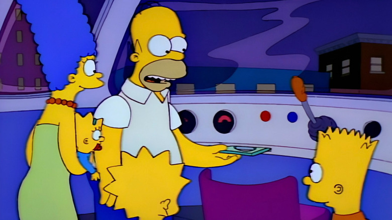 Homer showing his family the inside of the monorail in Marge vs. the Monorail