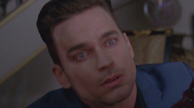 ECU of Matt Bomer holding Lady Laga's face in hands AHS Hotel