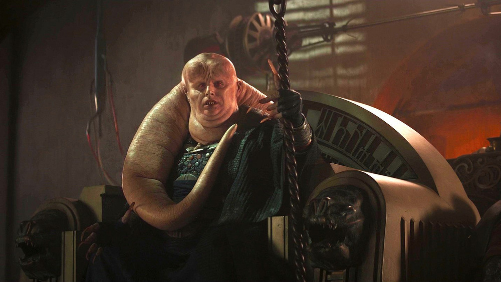 Bib Fortuna seated on Jabba the Hutt's throne