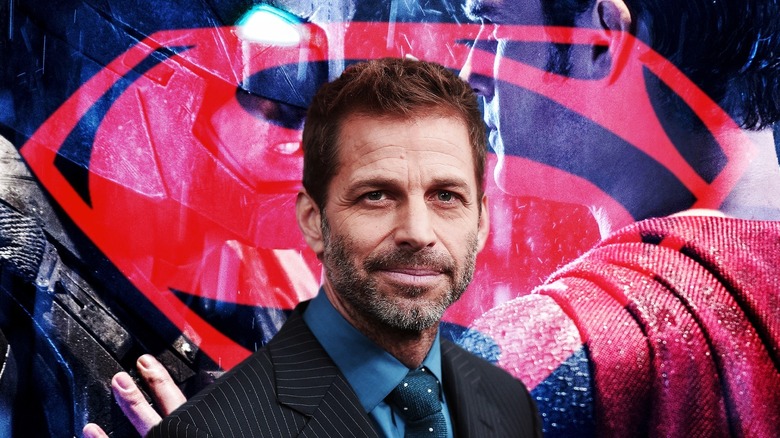 Zack Snyder with Superman logo, Batman, and Superman