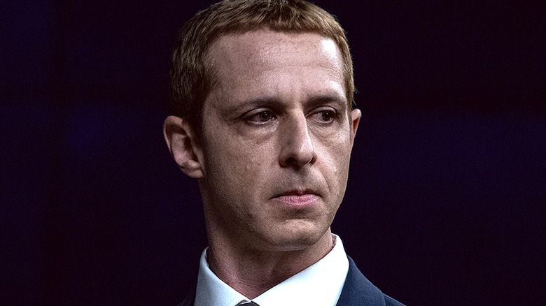 Mark Zuckerberg in a suit looking to the side in The Social Reckoning