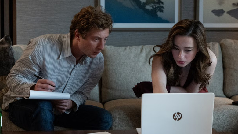 Jeff and Frances working in his hotel room in The Social Reckoning