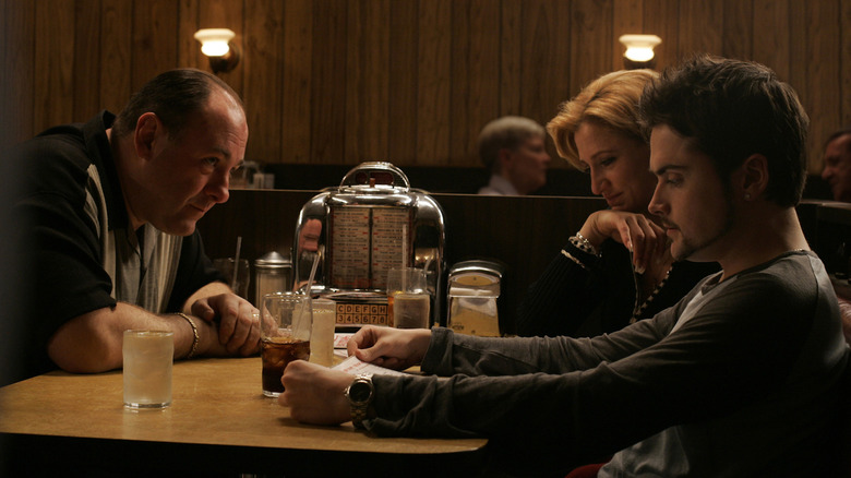 Tony, Carmella and AJ Soprano sitting in diner