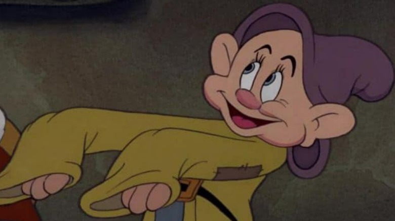 Dopey extending his arms and smiling
