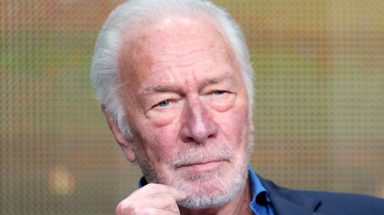 Christopher Plummer stroking his beard