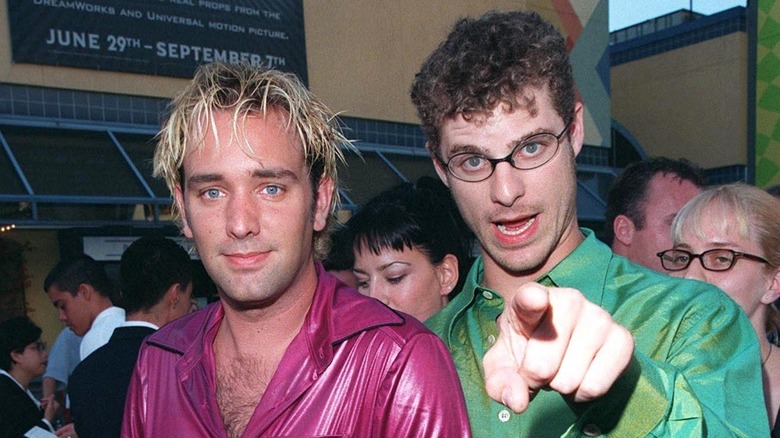 Trey Parker with Matt Stone pointing