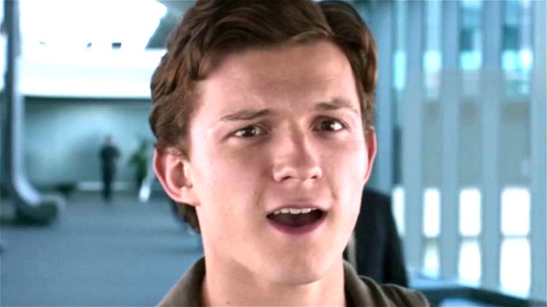Tom Holland smiling as Peter Parker