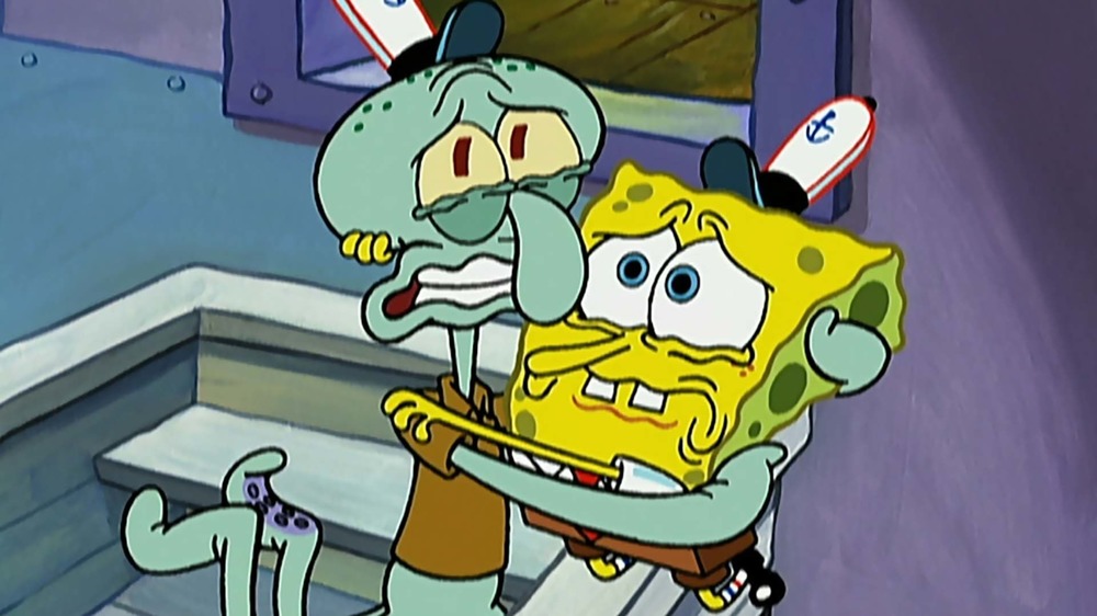 Squidward and SpongeBob hug each other in "Graveyard Shift"