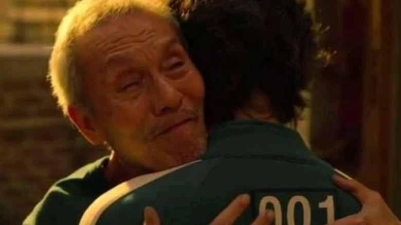 Il-nam and Gi-hun hugging