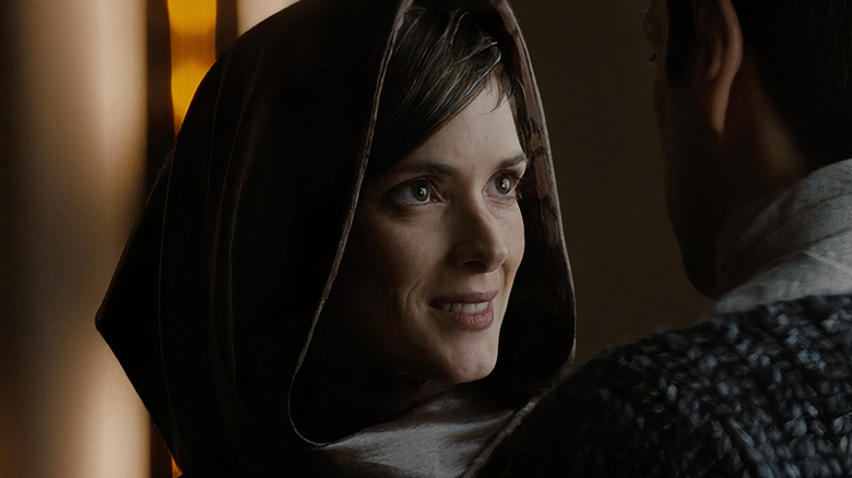 Amanda Grayson wearing brown hood