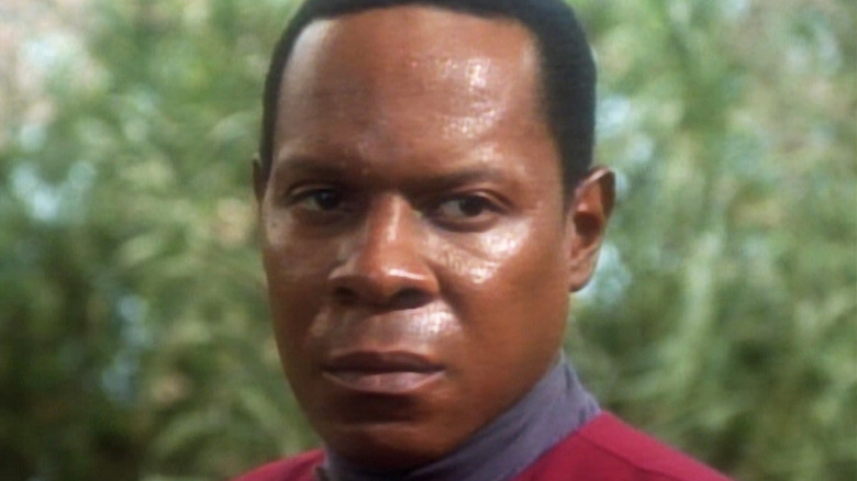 Captain Sisko looks on